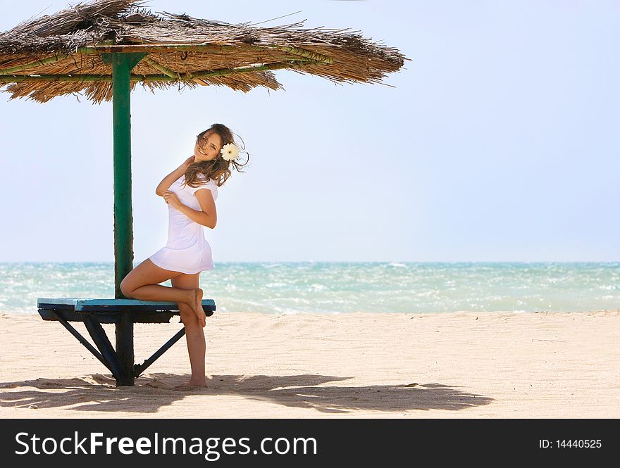 Young beautiful woman on beach