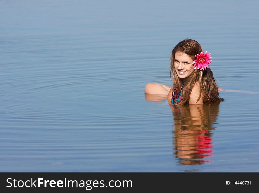 Young beautoful girl relaxing in water. Young beautoful girl relaxing in water