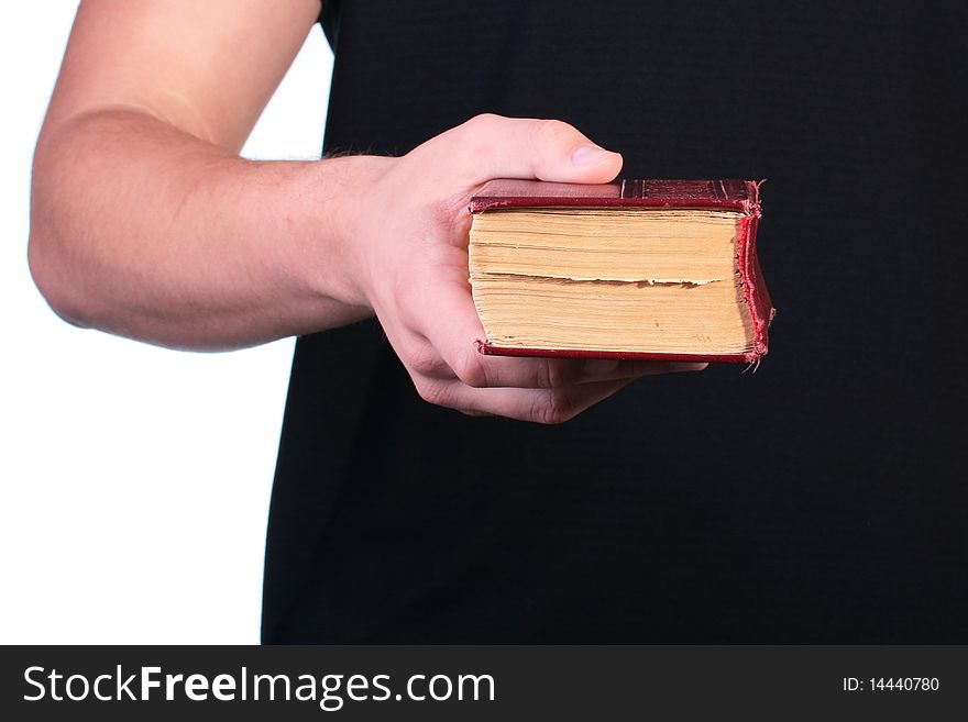 The man offers the old book in firm cover.