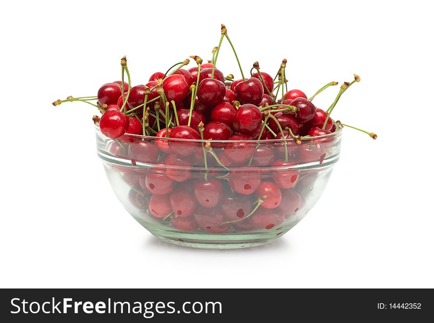Fresh ripe cherry berry in glass dish on white background