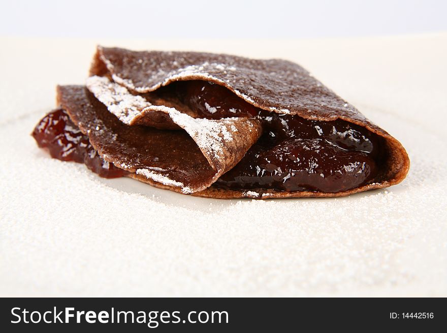 Chocolate pancake with jam