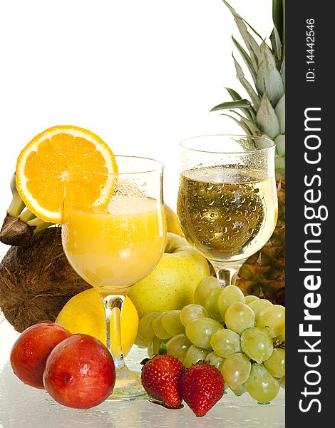 Various juice in glass surrounded by fresh fruit. Various juice in glass surrounded by fresh fruit