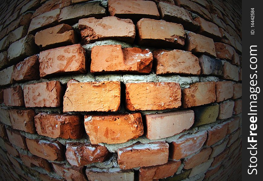 Fish eye wide angle distorted photo of an old brick wall. Fish eye wide angle distorted photo of an old brick wall