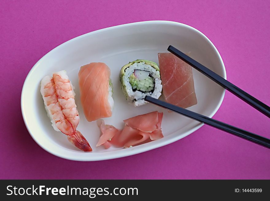 Sushi rolls on oval plate. Sushi rolls on oval plate