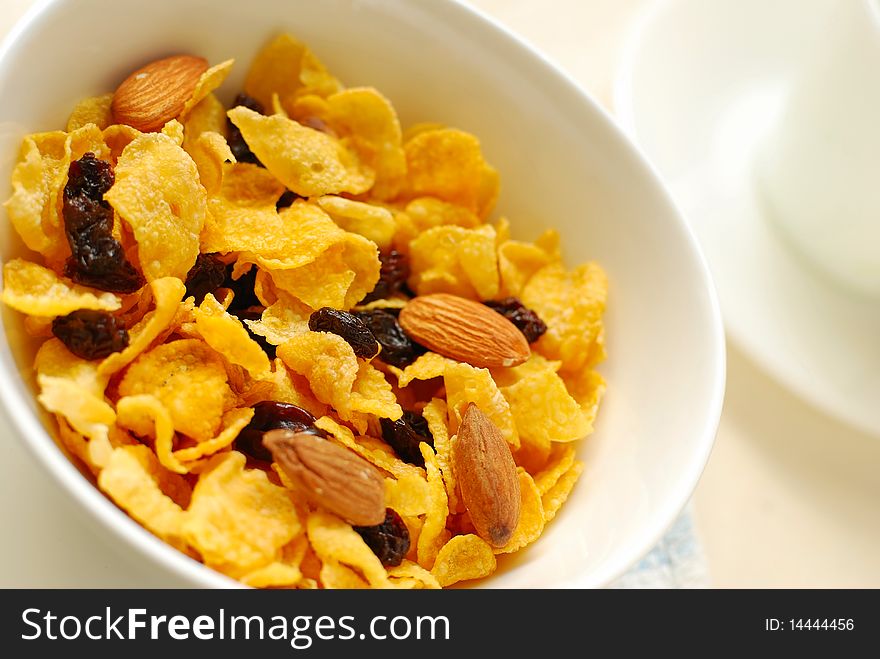 Healthy cereal with raisins and almond nuts for a nutritious and healthy breakfast or meal. Also for healthy eating and lifestyle, diet and nutrition, and food and beverage concepts.