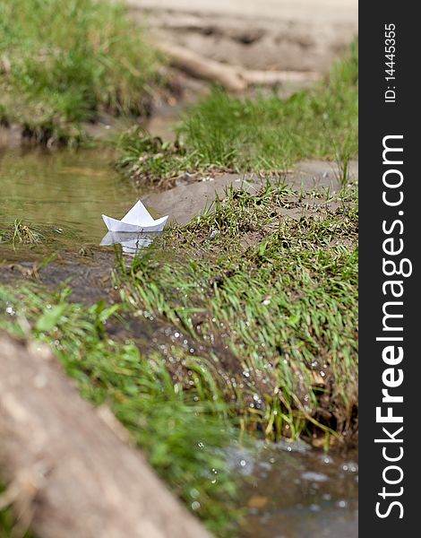 A Toy Boat in a Stream