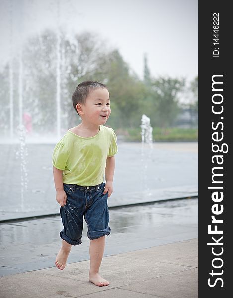 Happy asian boy in park