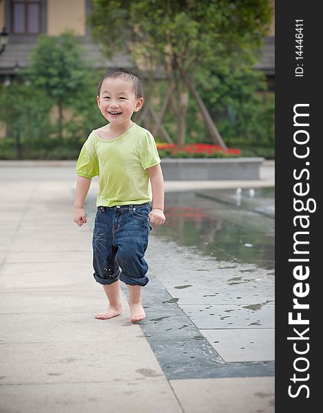 Laughing chinese boy in green