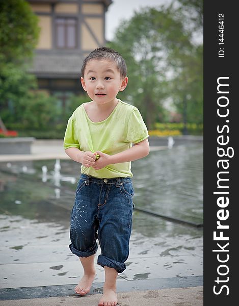 Cute chinese boy in green