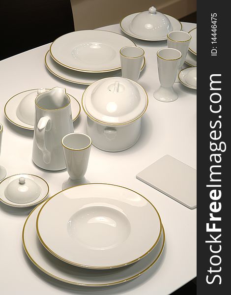 Served table with white classic dishes