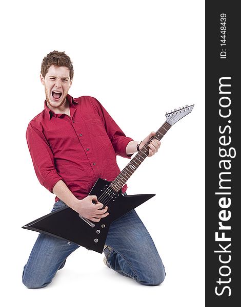 Excited young man playing a guitar isolated against white background