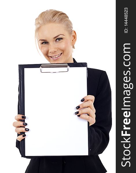Young business woman showing clipboard against studio background