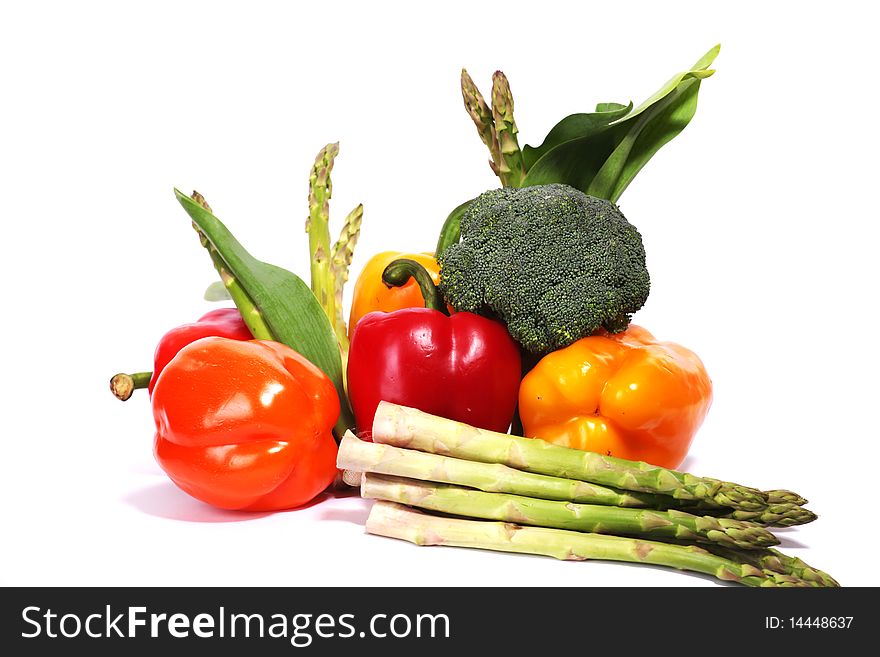 Heap of fresh ripe vegetables isolated at white background