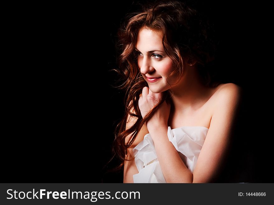 Portrait of a alluring young girl on black background. Portrait of a alluring young girl on black background.