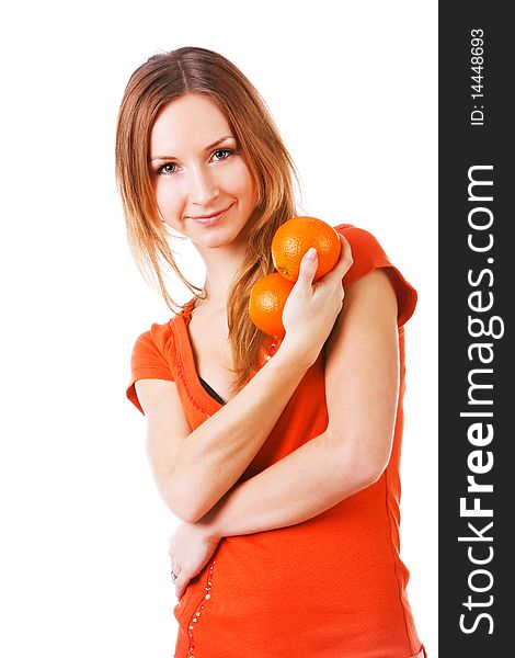Picture of a young pretty girl in dress which holds oranges. Isolated on white. Picture of a young pretty girl in dress which holds oranges. Isolated on white.