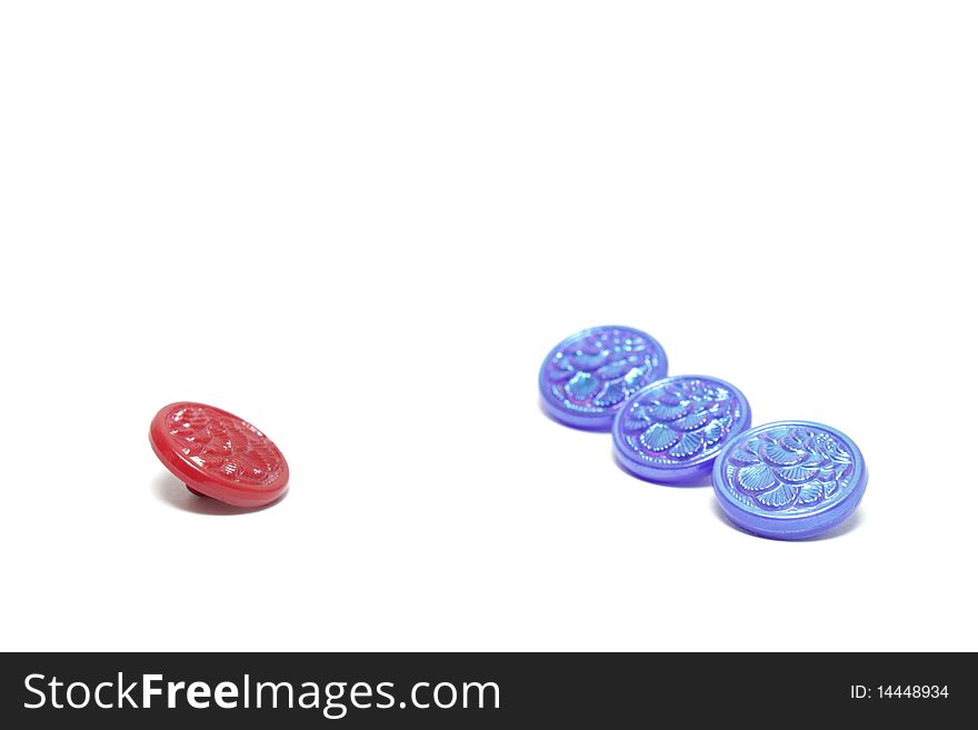 Red Button And Three Blue Ones Isolated