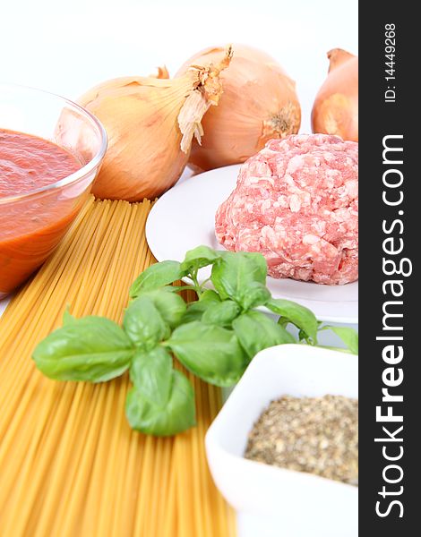 Ingredients for spaghetti bolognese on white background