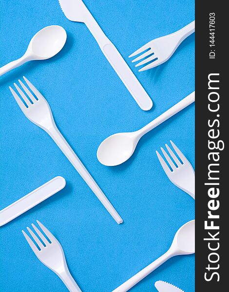 Disposable plastic tableware pattern on blue background