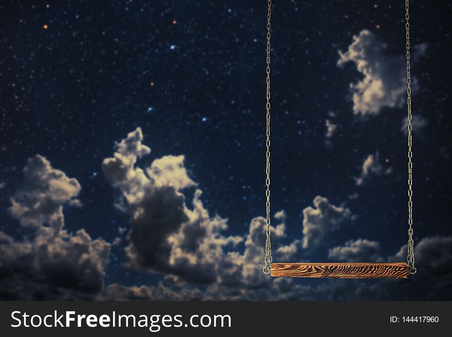 A swing on a night sky background