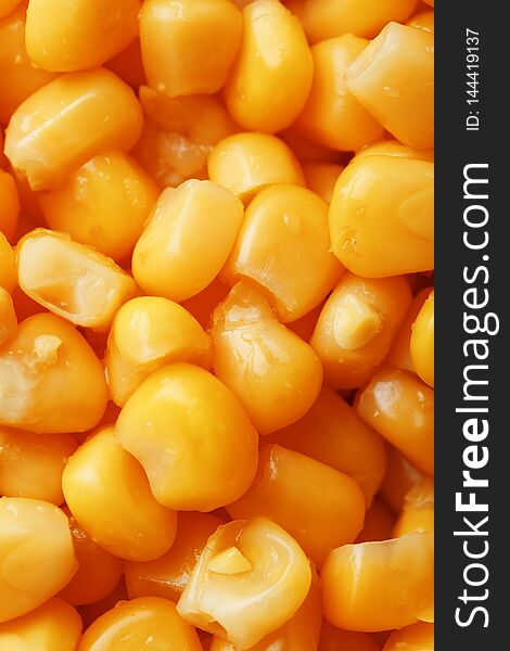 Golden Canned Corn, As Distributed On A Plane Background And Texture Of Popcorn. Before Watching A Movie Top View. Close-up