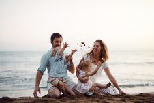Free A Family With Two Toddler Children Sitting On Sand Beach On Summer Holiday. Royalty Free Stock Photography - 144427307