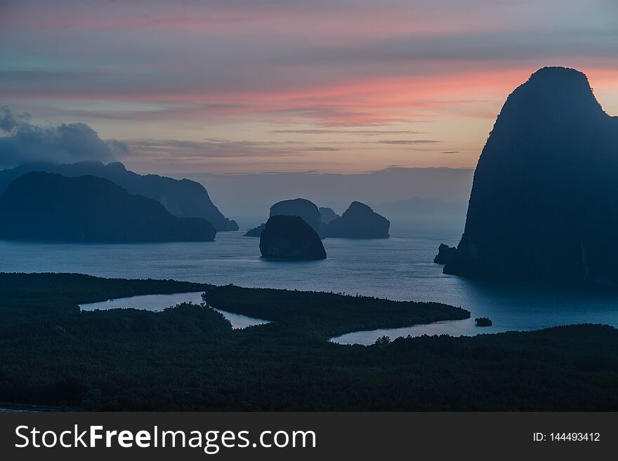 Epic view from the viewpoint of Samet Nang She to a number of islands in the bay. Thailand. Silhouette of the islands at dawn.