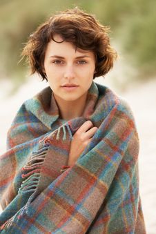 Woman Standing In Sand Dunes Wrapped In Blanket Royalty Free Stock Image