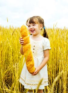 Girl With A Long Loaf Stock Photos Girl With A Long Loaf Stock Photos
