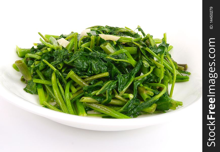 Fried spinach cabbage. Close up on white background