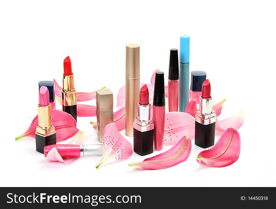 Lipstick and petals on a white background. Lipstick and petals on a white background