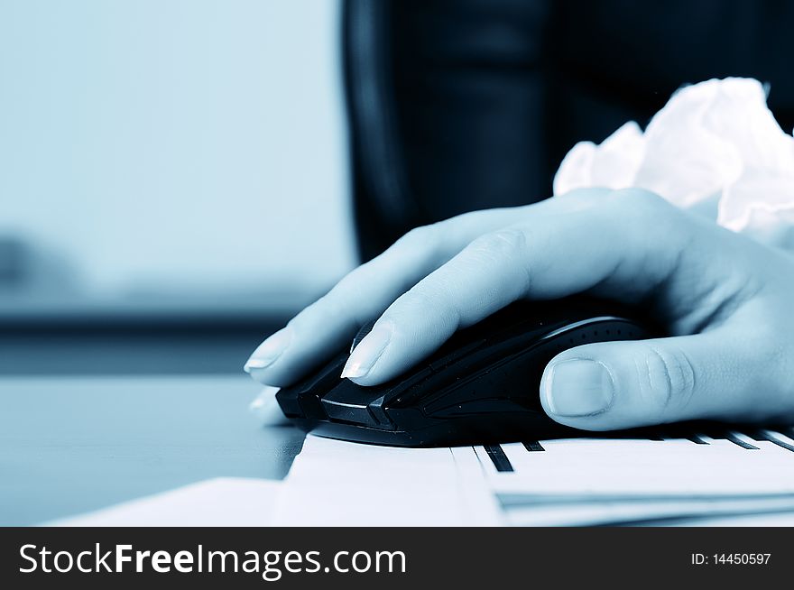 Hand of a young business woman working for a laptop. Workplace of business people.