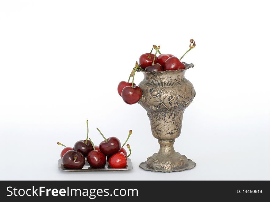 Cherries in a silver vase