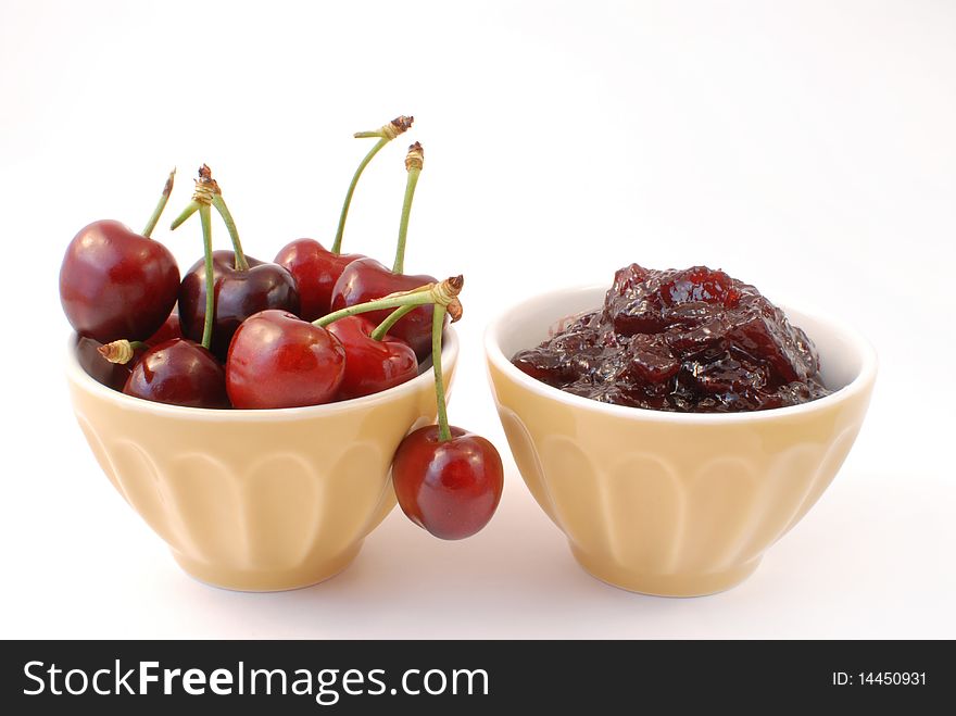 Cherries and cherry jam white background