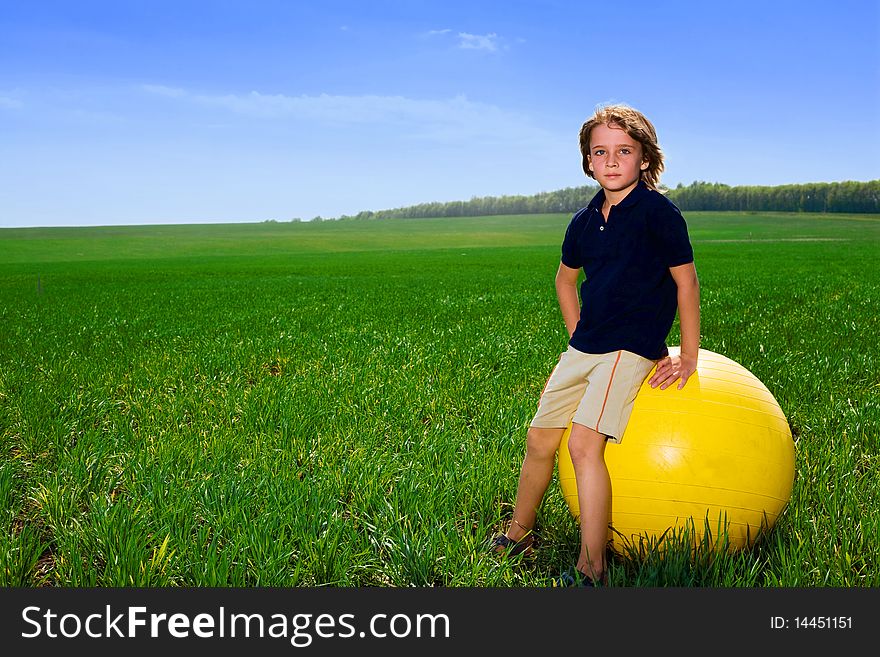 Boy With Ball In Field