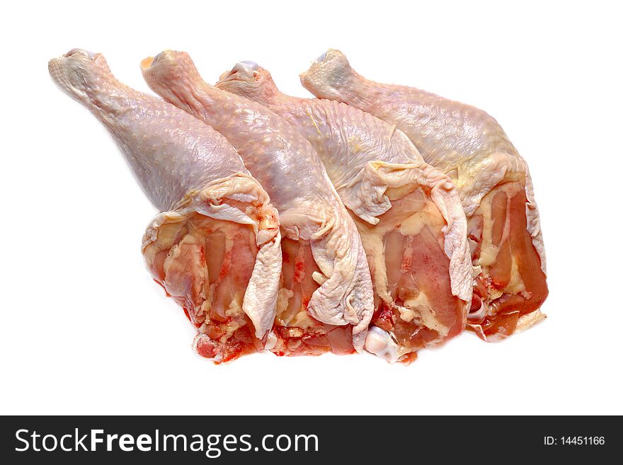 Raw chicken's legs isolated against white background