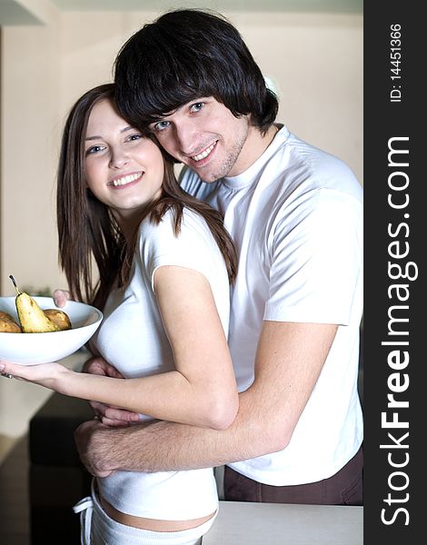 Boy with smile and beautiful girl with plate. Boy with smile and beautiful girl with plate