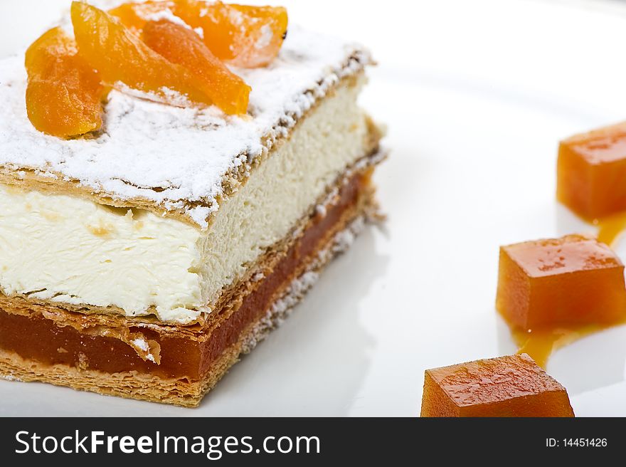 Fresh cream cake with apricots on plate