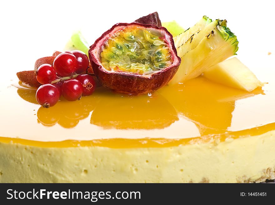 Fresh cream colorful cake on plate with fruits. Fresh cream colorful cake on plate with fruits
