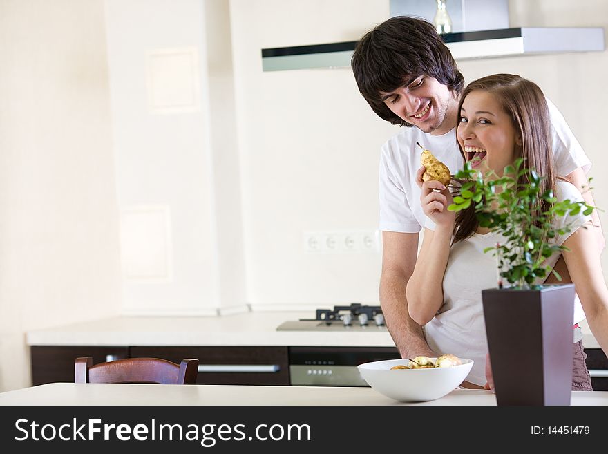 Girl With Smile And With Pear And Boy