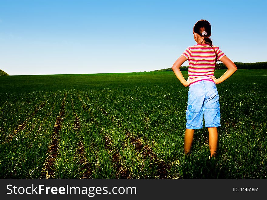 Small girl in green field. Small girl in green field