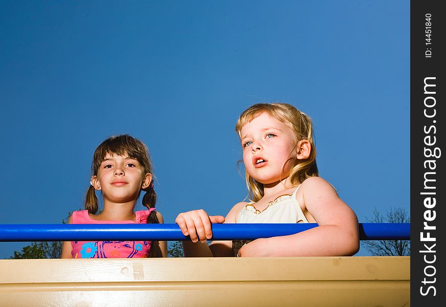 Two Girls On Blue Background