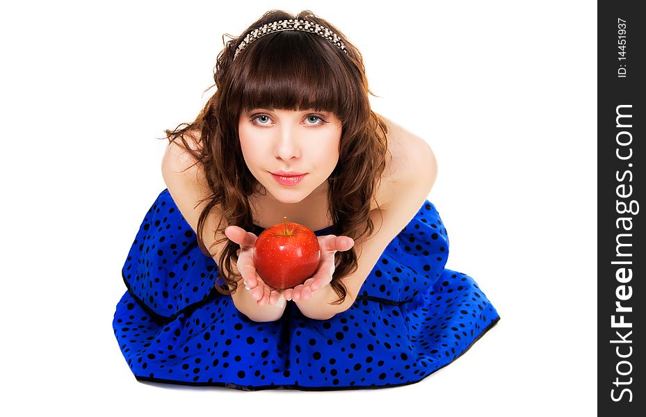 Lovely girl in a blue dress and brilliant diadem with a red apple. Lovely girl in a blue dress and brilliant diadem with a red apple