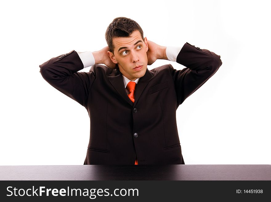 Pensive businessman on a desk at the office