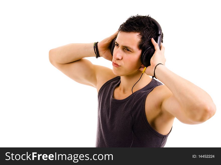 Young man listening music isolated on white