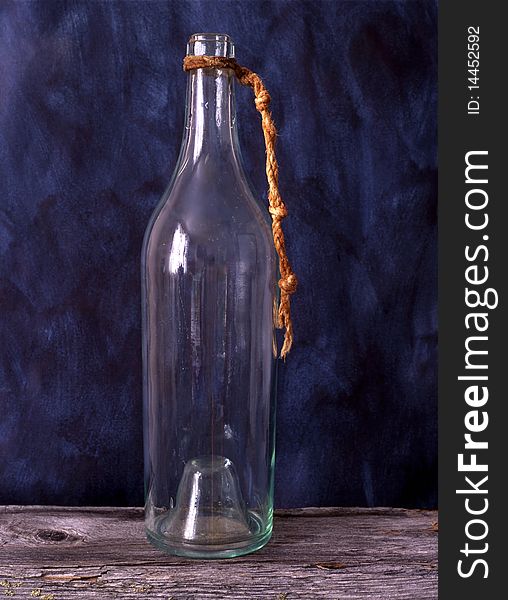 Old bottle isolated on painted background. Old bottle isolated on painted background