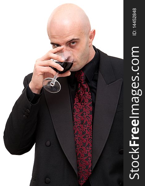 Young business man in dark suit holding a glass of wine. Young business man in dark suit holding a glass of wine