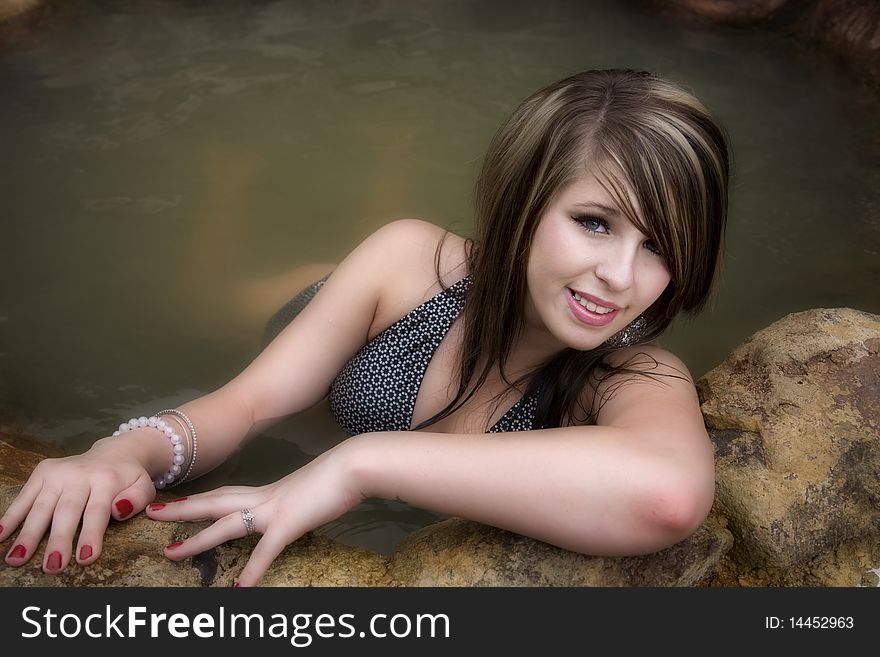 Woman In Swimsuit Leaning Forward Smiling