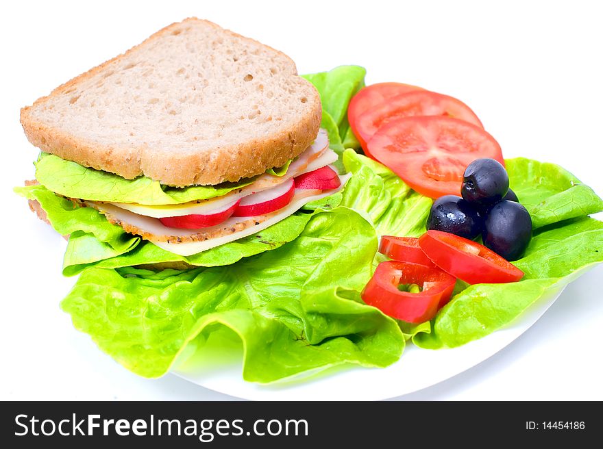 Big and tasty sandwich on a white plate