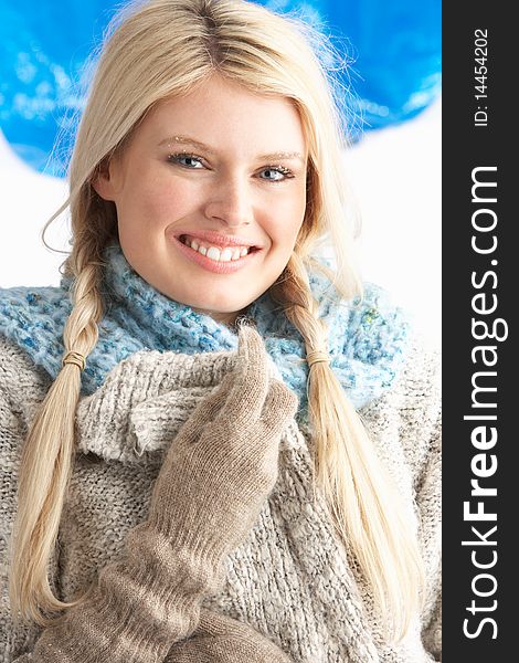 Pretty Young Woman Wearing Warm Winter Clothes In Studio. Pretty Young Woman Wearing Warm Winter Clothes In Studio