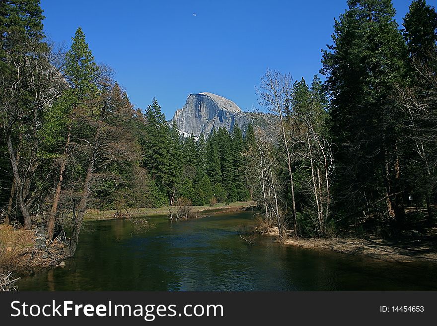 This is a picture of the Half Dome with The Merced River in the southern part of Yosemite National Park in California USA